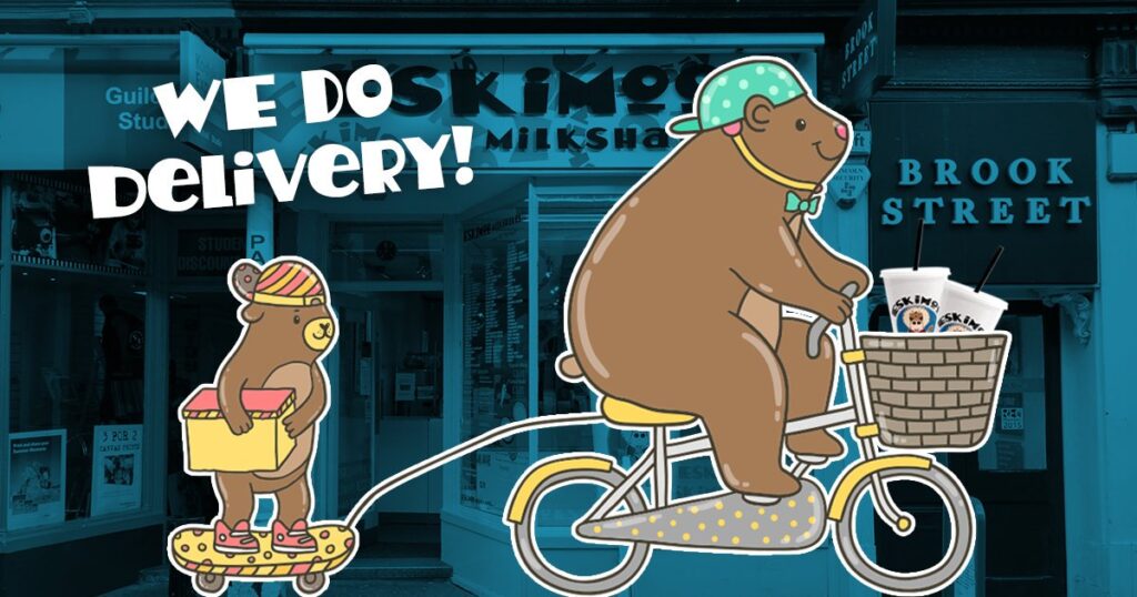 A cartoon bear on a bike with Eskimoo milkshakes in it's basket. It is riding away from an Eskimoo store pictured in the background with a bear cub in tow. Text reads: We Do Delivery!